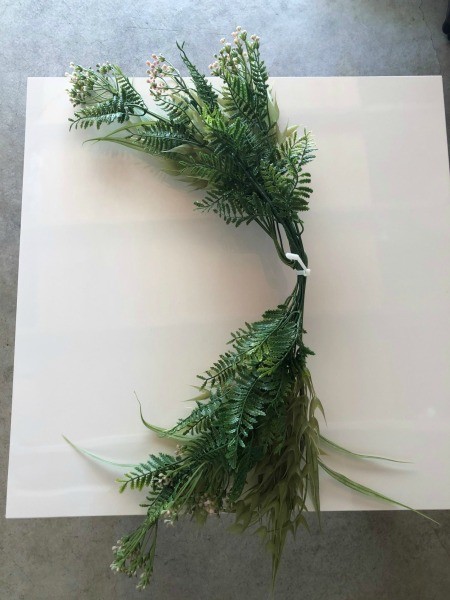 Swag Decoration For Less - grass placed underneath flowers and tied together