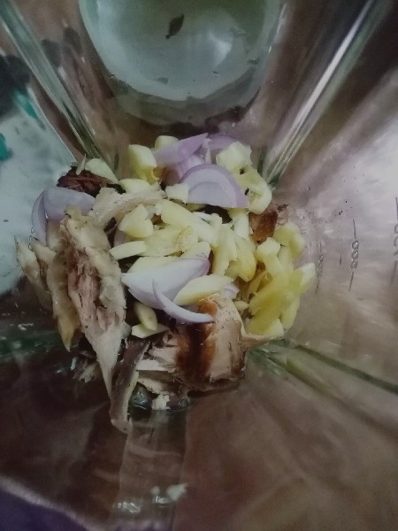 Chopped ingredients inside a blender.