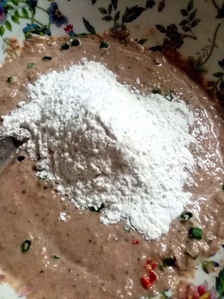 Adding flour to the mixture.