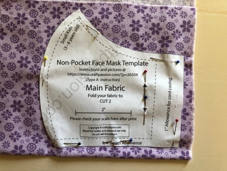 Non Pleated Child's Mask - main fabric pattern pinned to floral fabric