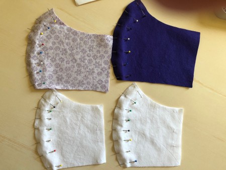Non Pleated Child's Mask - main fabric and lining pieces pinned down center seam