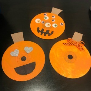 CD Pumpkin Wall Decorations - three finished pumpkins on black background