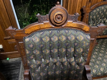 A wooden fabric covered chair.