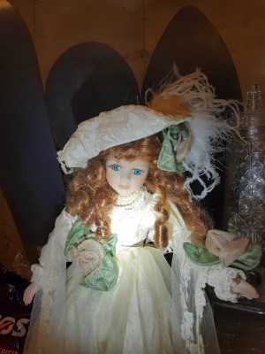 A collectible doll with red hair.