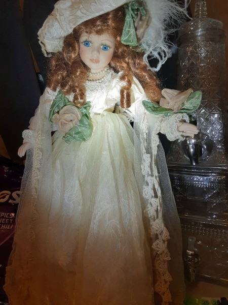 A collectible doll with red hair.