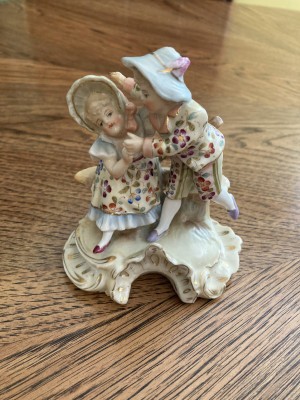 An old fashioned porcelain figurine couple.