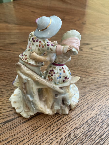 The back of a porcelain figurine couple.