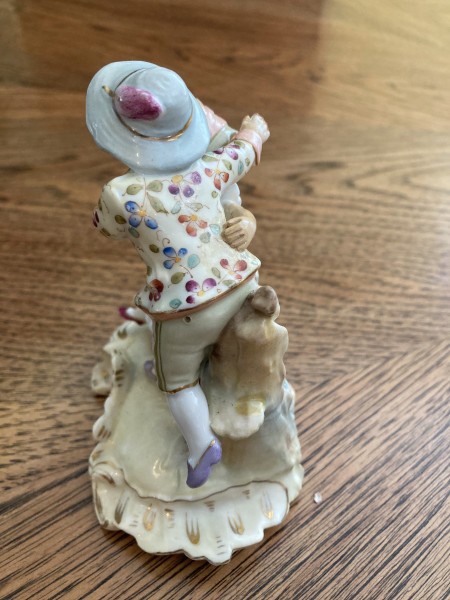 The back of a porcelain figurine couple.