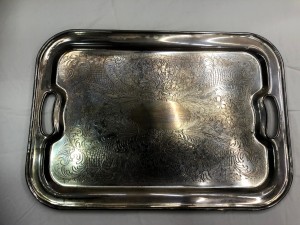 A silver tray with handles.