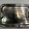 A silver tray with handles.