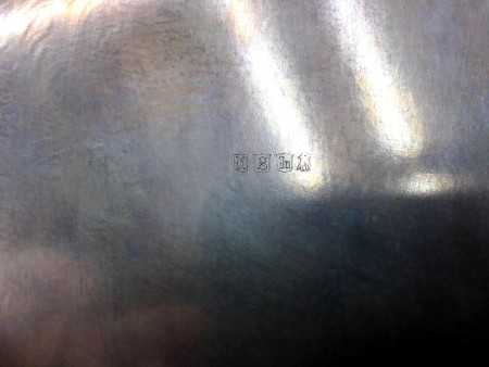 The marking on the back of a silver tray.