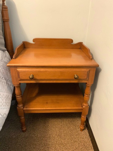 A wooden nightstand.