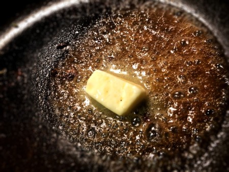 Melting butter in the frying pan.