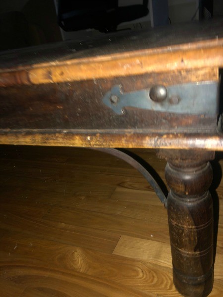 The front of a wooden table.
