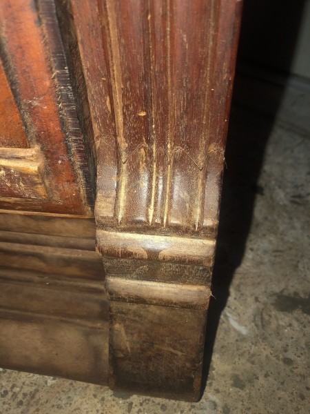 The bottom of an antique dresser.