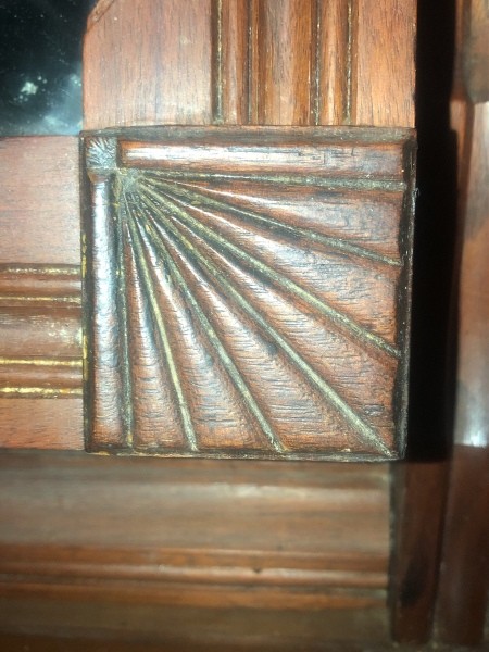 The detail of an antique dresser.