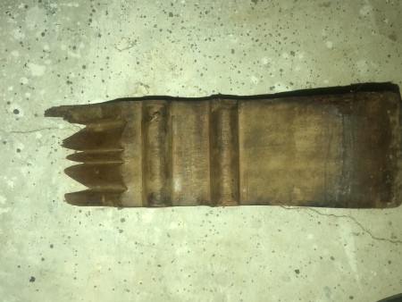 The foot of an antique dresser.
