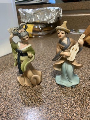 Two Japanese figurines.