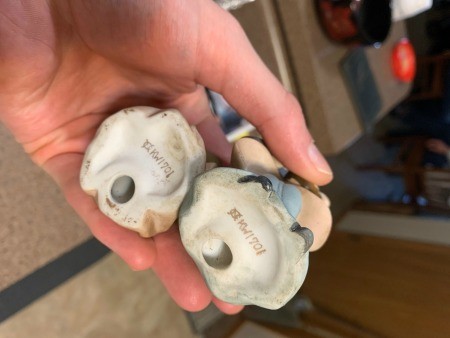 The bottom of two Japanese figurines.
