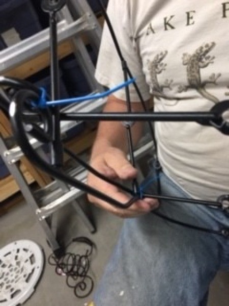 Bug Sculpture - temporarily holding parts for head, wings, and tail in place using zip ties