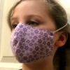 Non Pleated Child's Mask - child wearing the purple floral mask