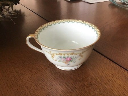 Value of a Set of Noritake Dishes? - tea cup with floral pattern on outside and decorative edge inside