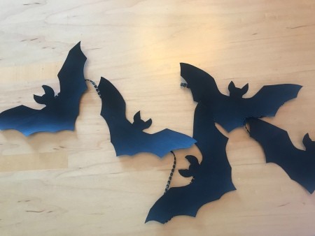Simple Bat Garland/Bat Wall Decorations - garland lying on a faux wood surface