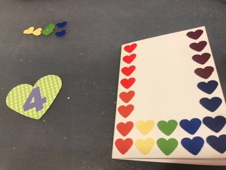 Rainbow Happy Birthday Card - smaller hearts being glued in place
