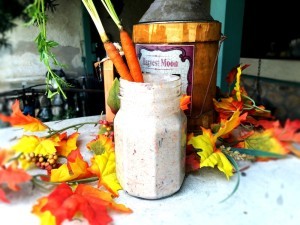 A completed carrot cake overnight oats in a mason jar.