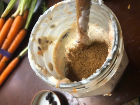 Adding spices to the oat mixture.