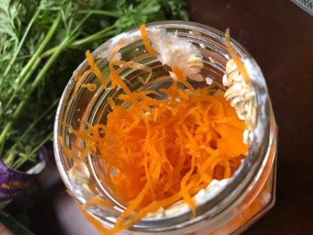 Shredded carrots added to the oat mixture.