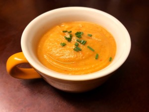 A bowl of red pepper parsnip soup.