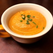 A bowl of red pepper parsnip soup.