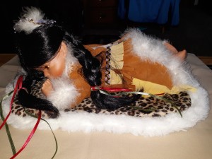 Value of a Goldenvale Porcelain Doll? - Native American doll lying down