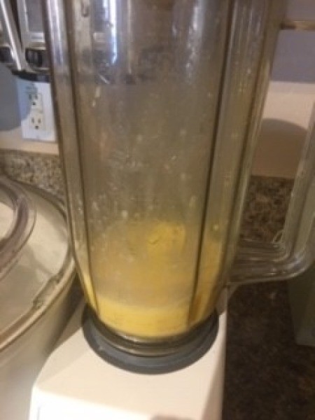 A blender filled with the batter for Dutch Baby.