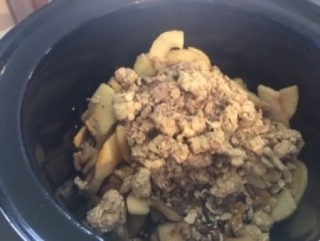 Adding the ingredients to a Crockpot.