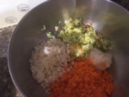 Mixing finely diced vegetables together.
