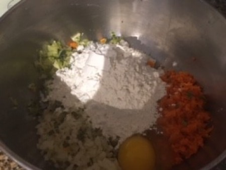 Adding flour to the vegetable mixture.