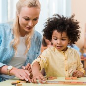 A teacher working with a young student.