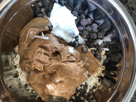 Mixing the ingredients for energy bites in a bowl.