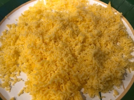 A plate of shredded cheese.