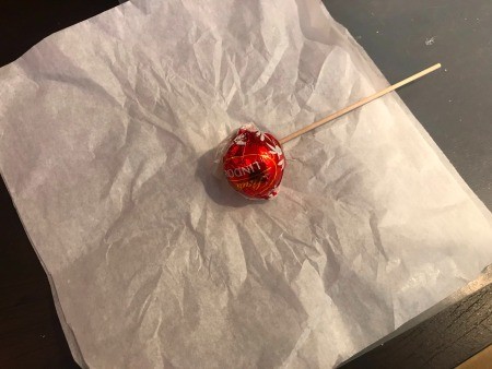 Ghost Candy & Display Stand - candy laying on layered tissue paper