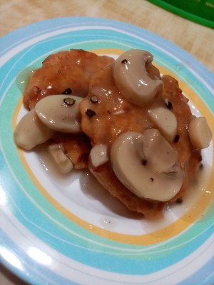 The finished plate of tuna and ham mushroom pepper steak.