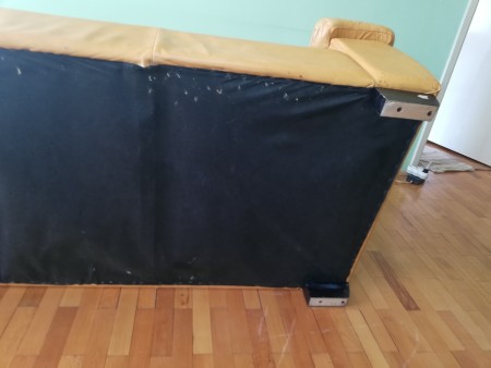 The bottom of a leather sofa.