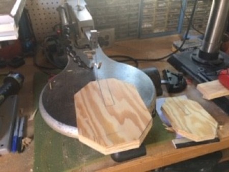 Wooden Fall Pumpkins - shape with the notch marked sitting on a scrolling saw base