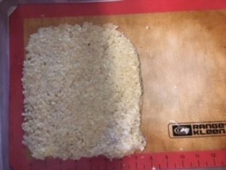 Making a loaf of the cauliflower mixture.