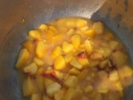 The peach mixture in a bowl.