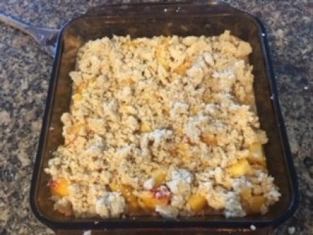 A baking pan of peach bars before cooking.