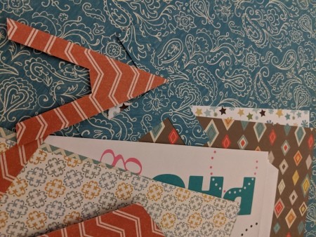 Happy Birthday Cut Letter Banner - pieces of paper and a letter A