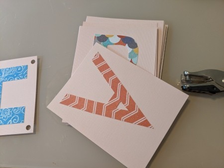 Happy Birthday Cut Letter Banner - punching holes in the upper corners